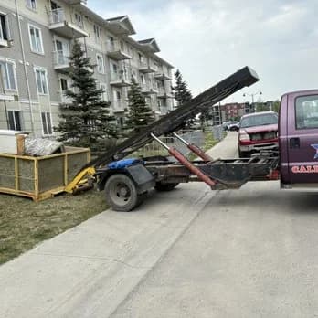 Bin trailer rental service at a Calgary apartment complex